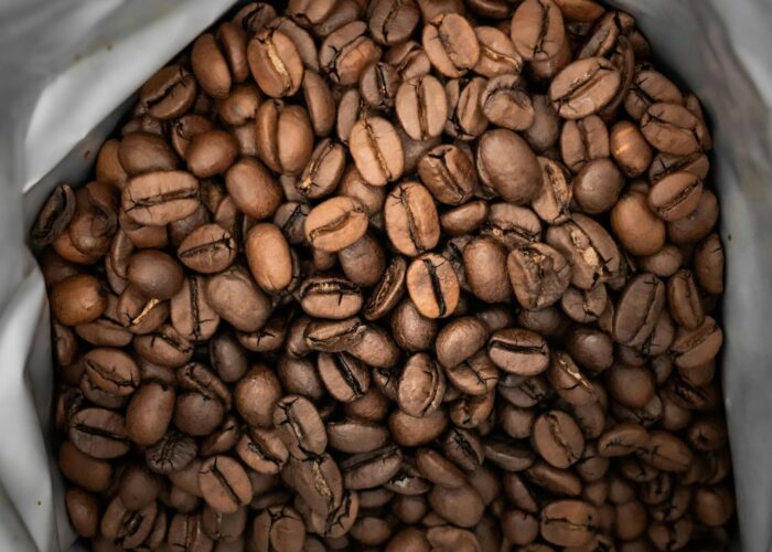 Close-up of aromatic roasted coffee beans inside a silver package, Germany.